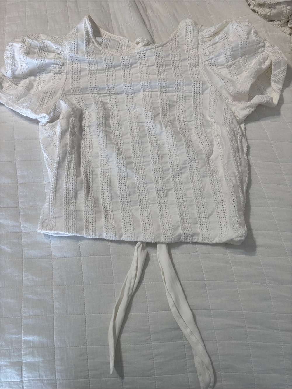 Free People white eyelet cotton short-sleeve top with tie back and puff sleeves